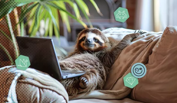 un paresseux allongé sur un canapé utilisant un ordinateur portable pour travailler