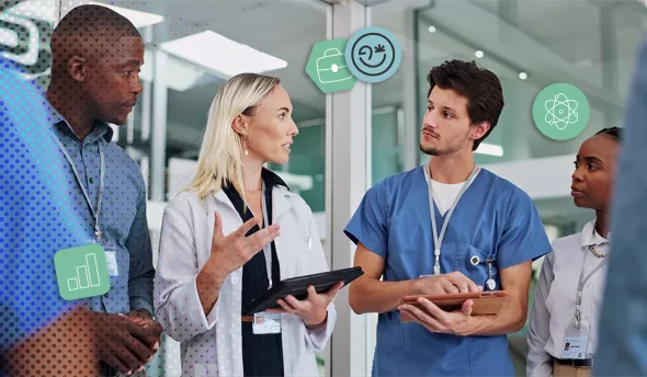 Réunion d’une équipe médicale composée de soignants, de professionnels de santé, et technicien informatique.