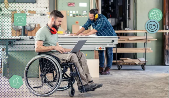 Salarié en situation de handicap travaillant sur ordinateur en entreprise
