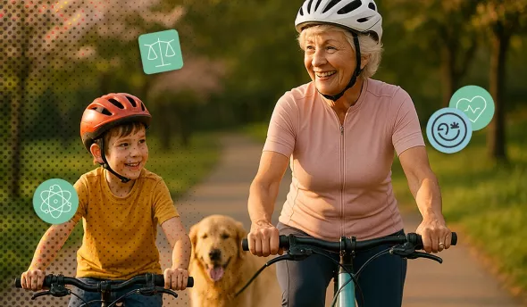 Grand-mère de 68 ans à vélo avec son petit-fils et leur golden retriever dans un parc