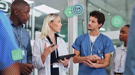 Réunion d’une équipe médicale composée de soignants, de professionnels de santé, et technicien informatique.