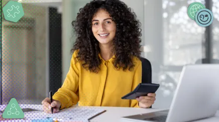 Comptable data analyst analysant des données financières sur tablette et ordinateur